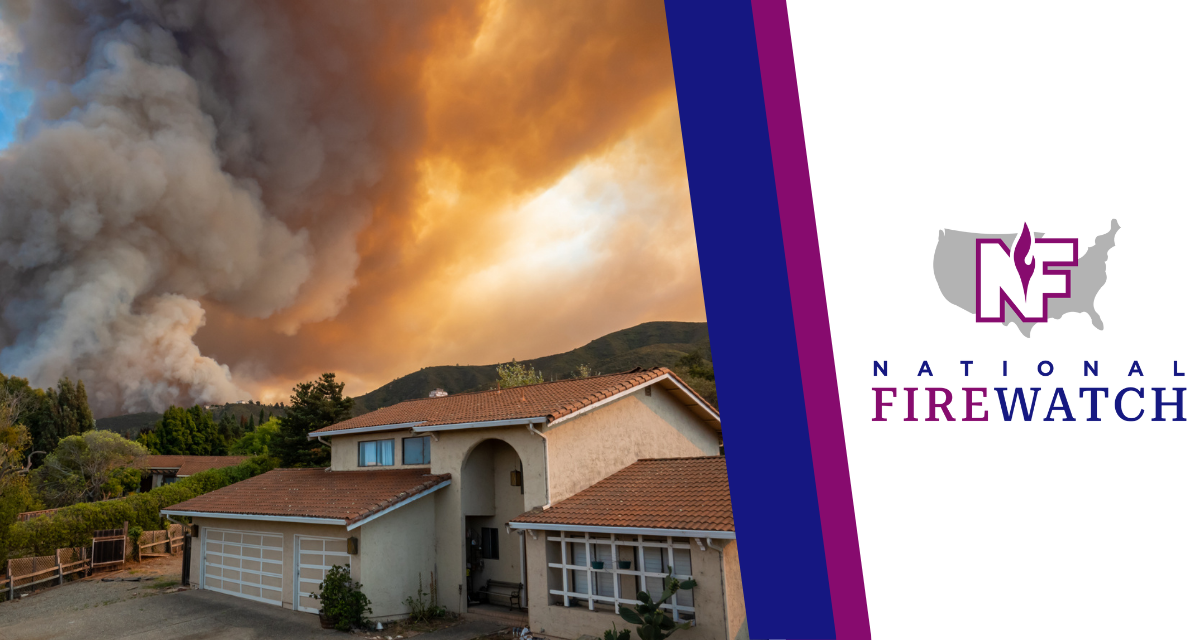 Fire burning behind a house